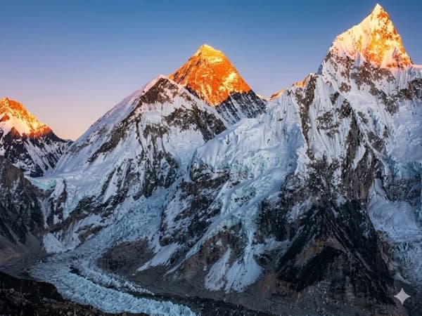 Trekkers on Kala Patthar above Everest Base Camp with Mount Everest behind